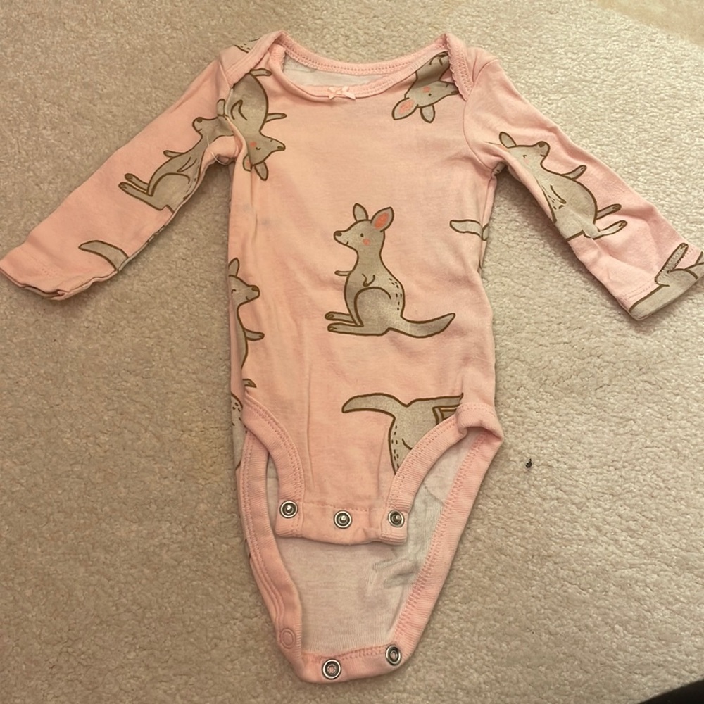Pink onesie with kangaroos all over